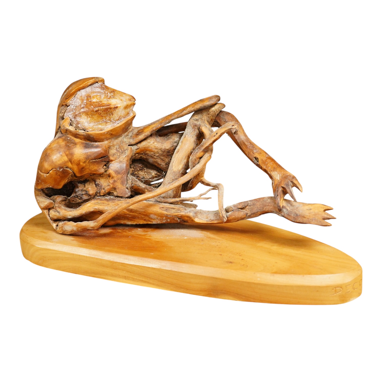Pierre Decorse (b.1953), a wooden sculpture of a reclining frog-like figure, base 34cms long